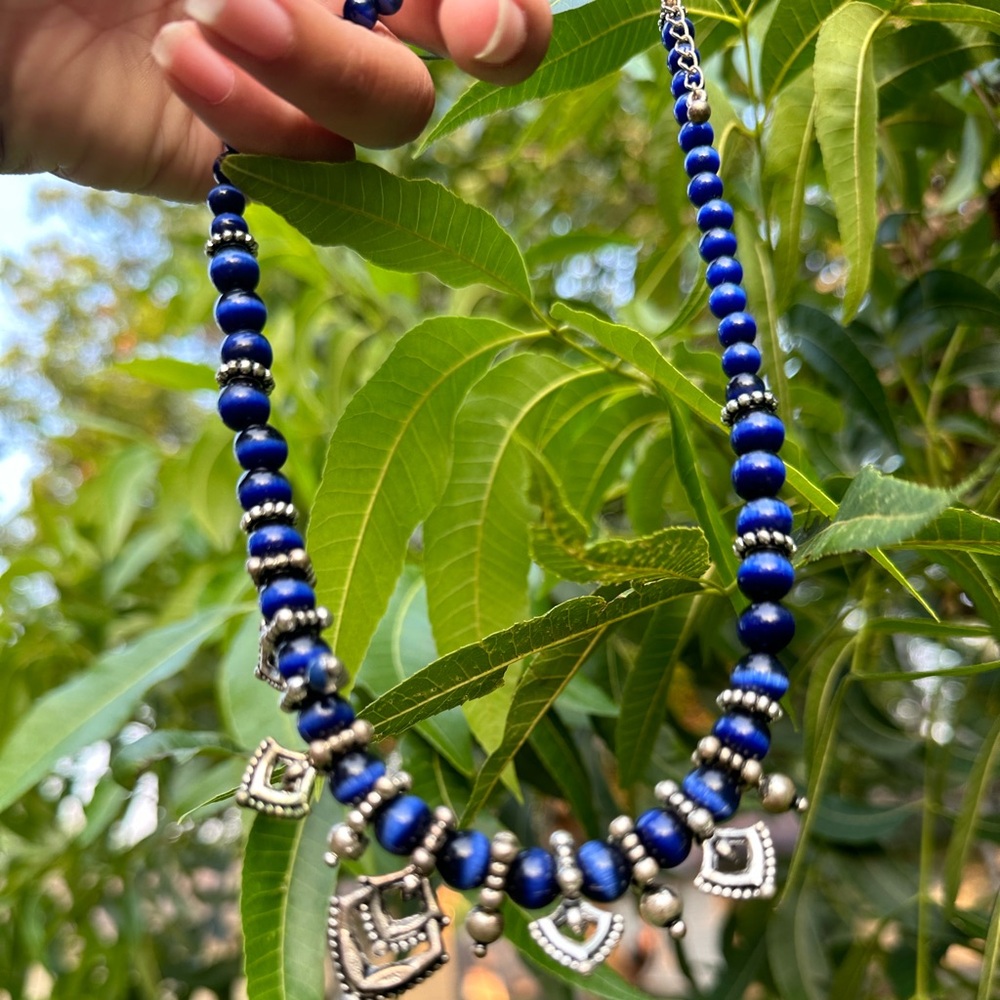 black and dark blue necklace